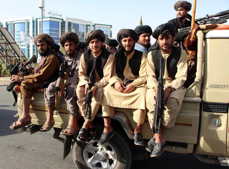Taliban authorities on a truck in Kandahar.
