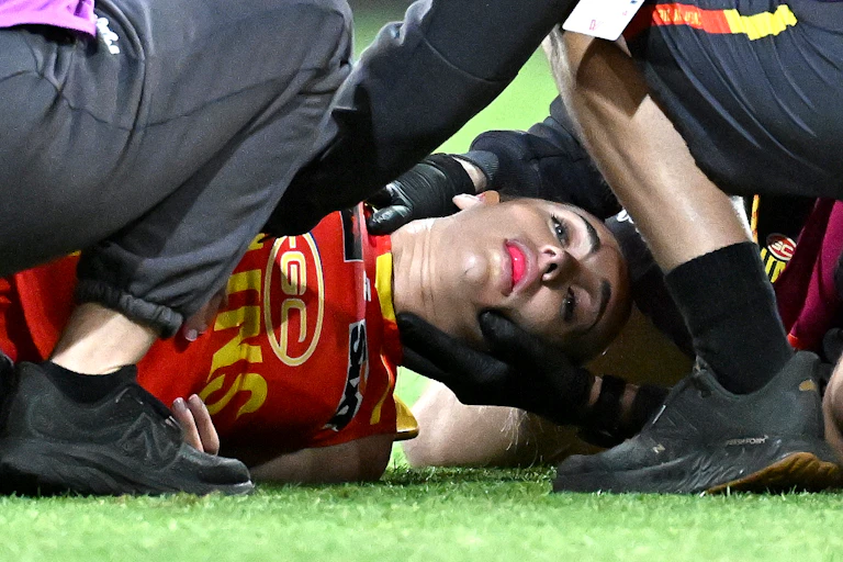 Elise Barwick of the Suns lays injured during a 2023 AFLW clash