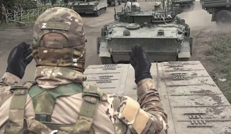 A Russian armoured vehicle with soldier on top.