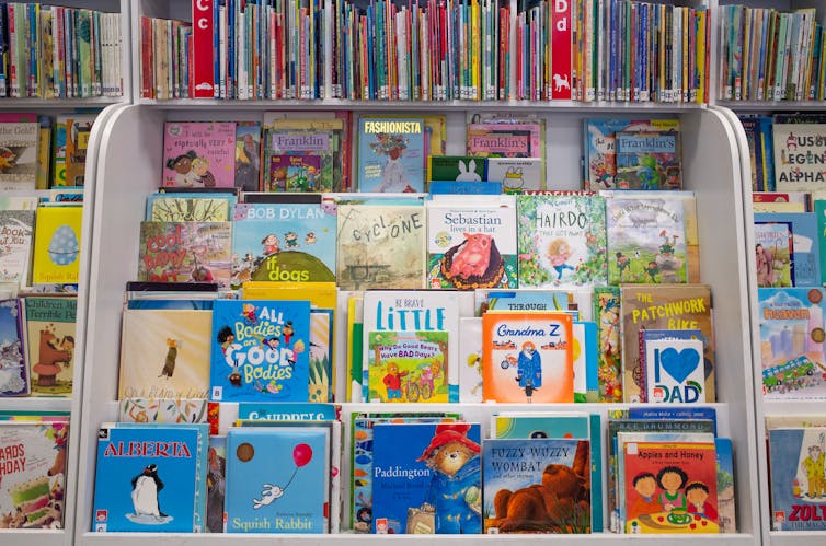Rows of children's books at a library.