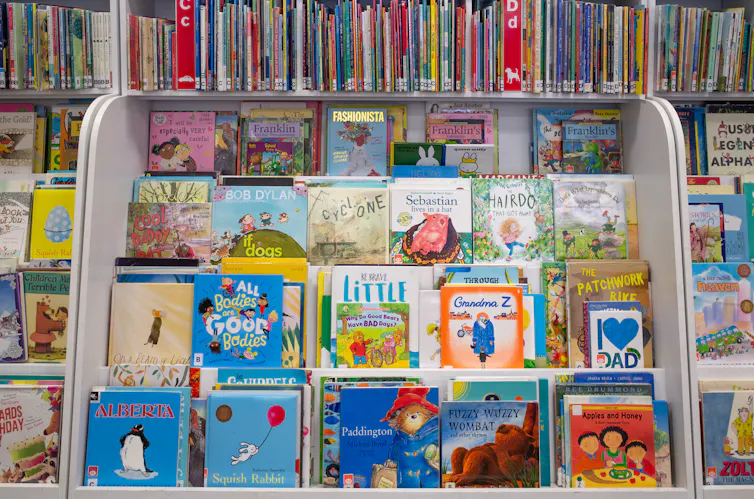 Rows of children's books at a library.