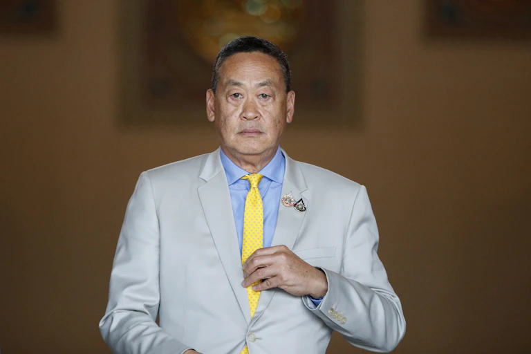 Srettha Thavisin in a grey suit.