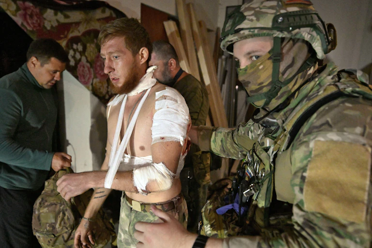 Wounded men in Russian army uniforms after a bombardment by Ukrainian troops August 11 2024.