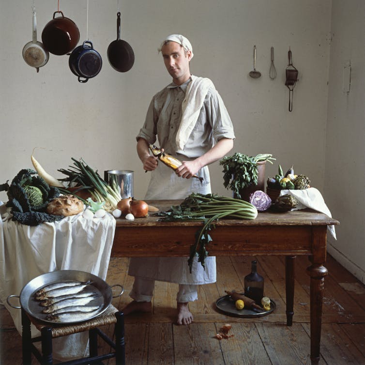 A cook at a kitchen table.
