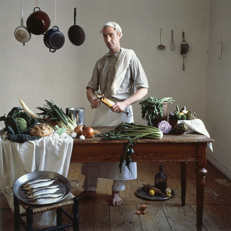 A cook at a kitchen table.