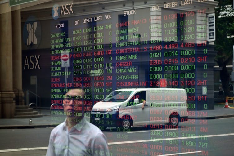A digital board at the Australian Securities Exchange (ASX) is seen in Sydney