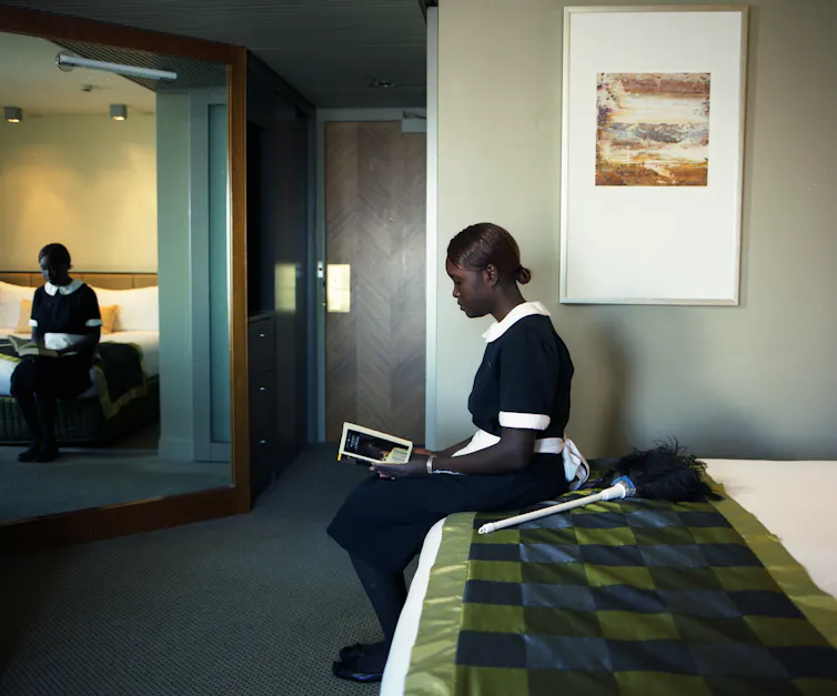 A maid reads a book.