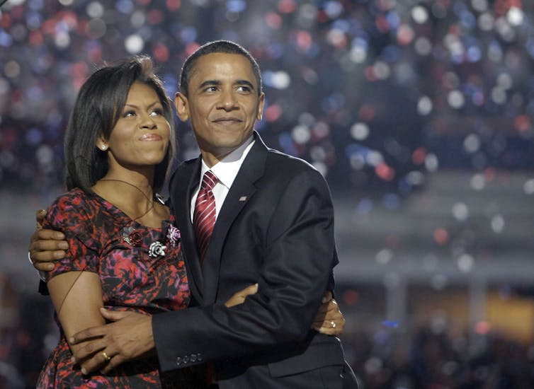 Barack Obama hugging his wife, Michelle.