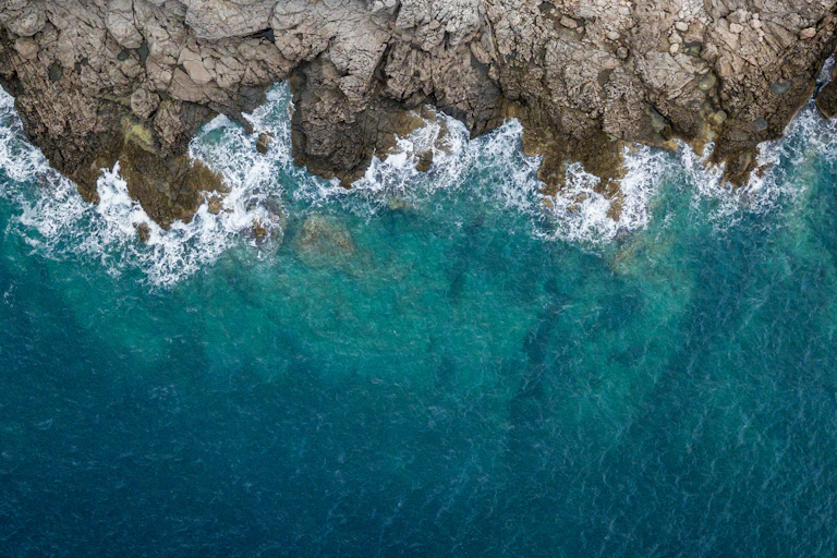 Waves crashing against rocks.