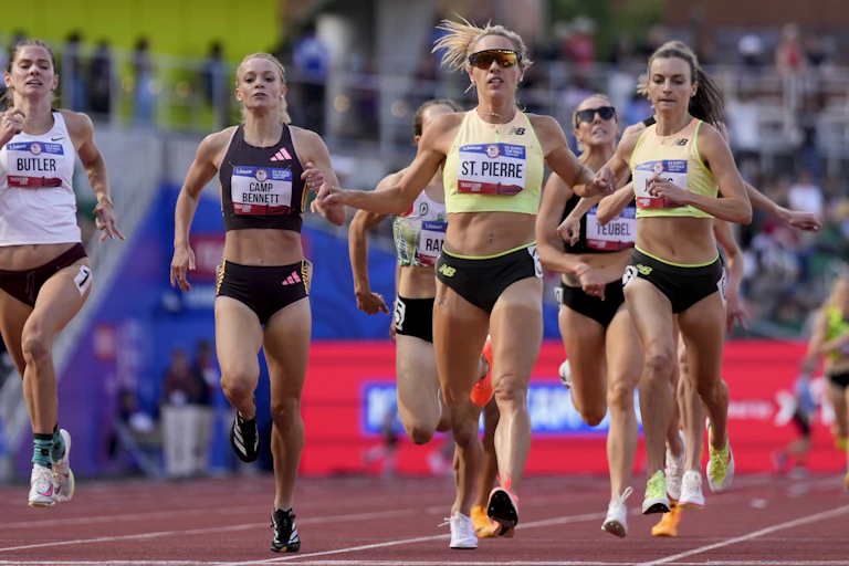 Female athletes running on a track