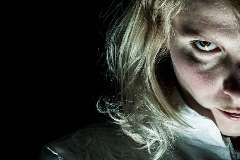 Blonde woman looking menacing