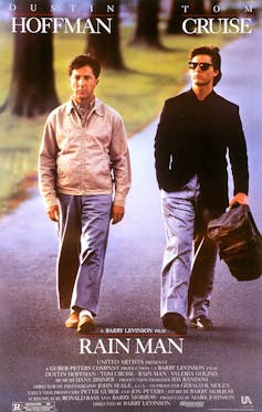 The film poster for Rain Man: Dustin Hoffman as Raymond and Tom Cruise as his older brother, walking down a road