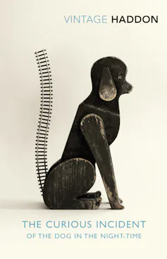 The Vintage Curious Incident cover: A dog sitting, with a tail like a train track
