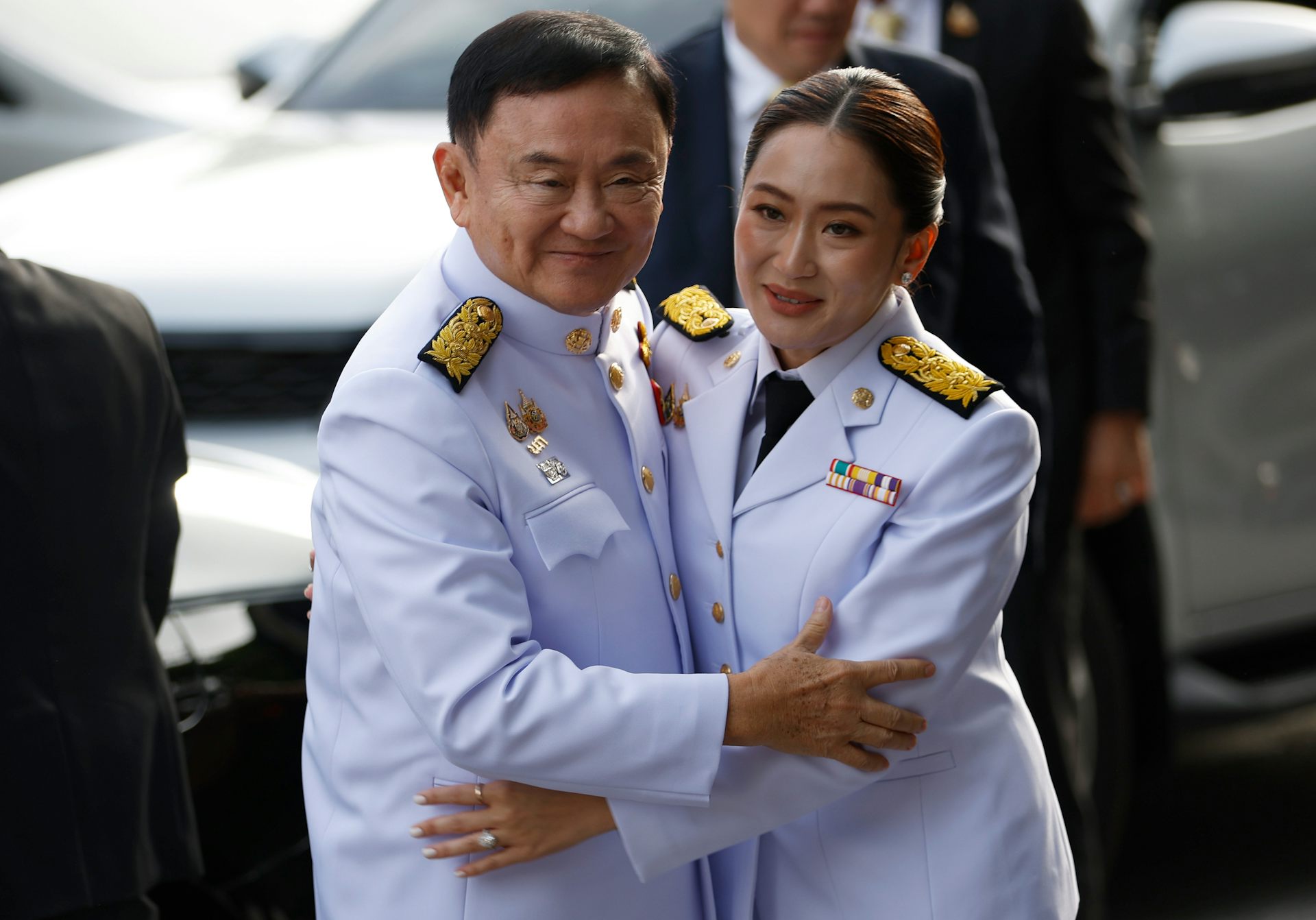 Paetongtarn Shinawatra hugging her father, Thakin Shinawatra.