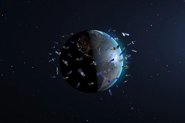 An illustration of satellites flying around the Earth