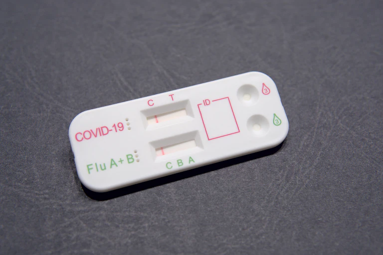 Plastic rapid test with COVID-19 and Flu A+B testing strips