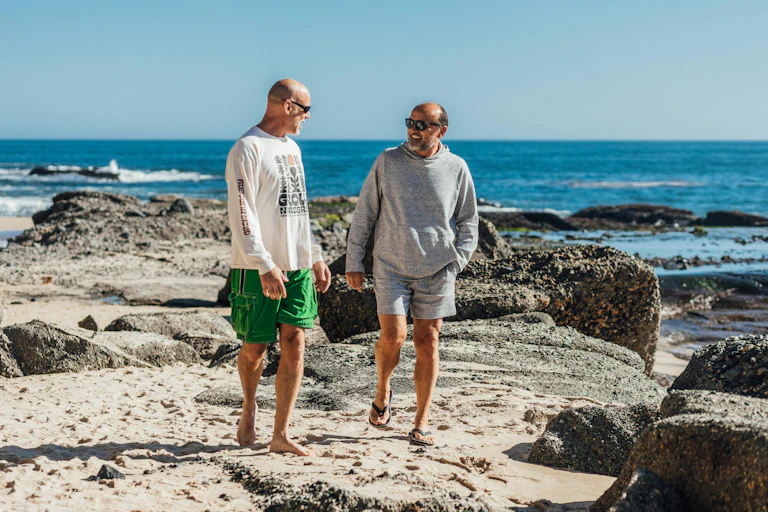 Men walk on the beach