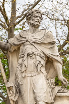 A statue of Hannibal stands in a garden.