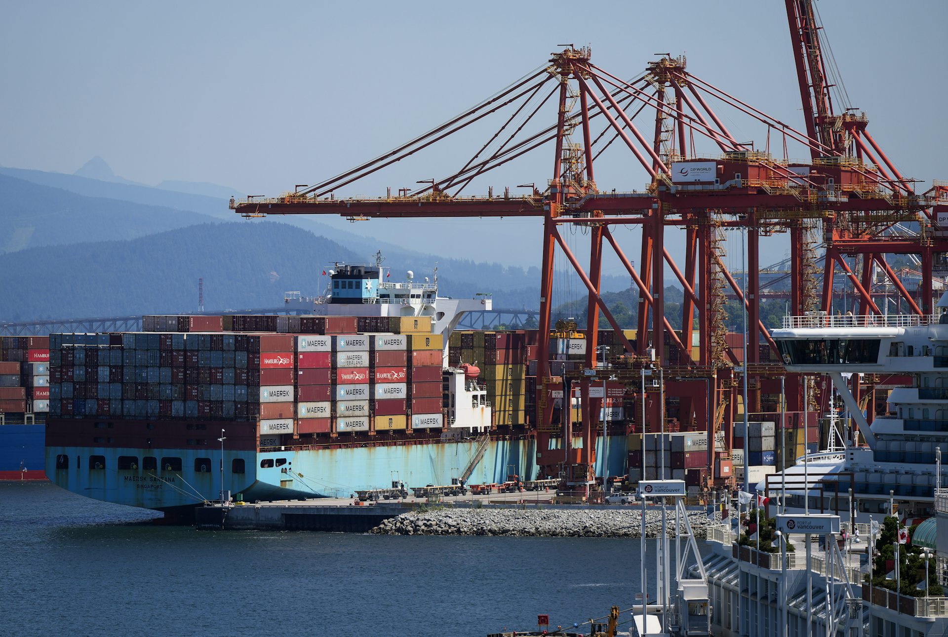 A large cargo ship is seen in port.