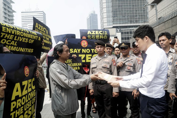 protestors handing petition in jakarta