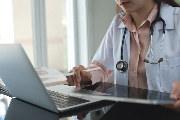Female doctor at laptop