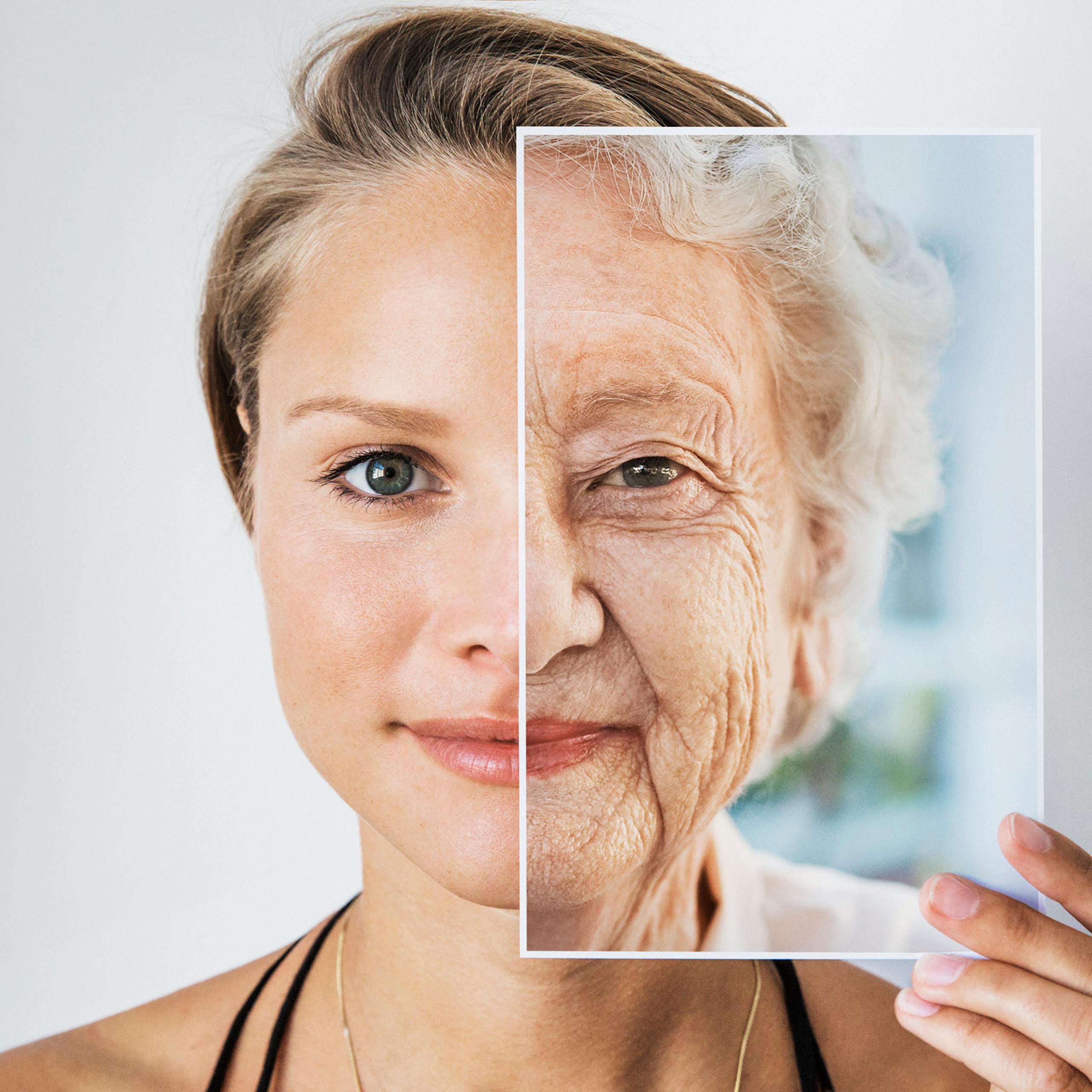 Younger person holding image of an older person's face over half of their own