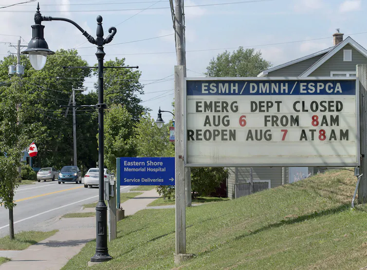 A sign in front of an emergency ward warns of overnight closures.
