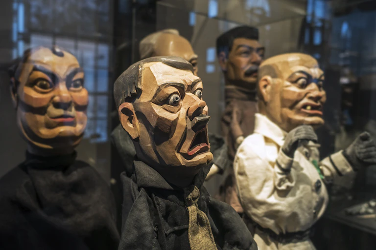 Wooden hand puppets featuring World War Two leaders Adolph Hitler, Roosevelt, Stalin, Churchill and Mussolini.