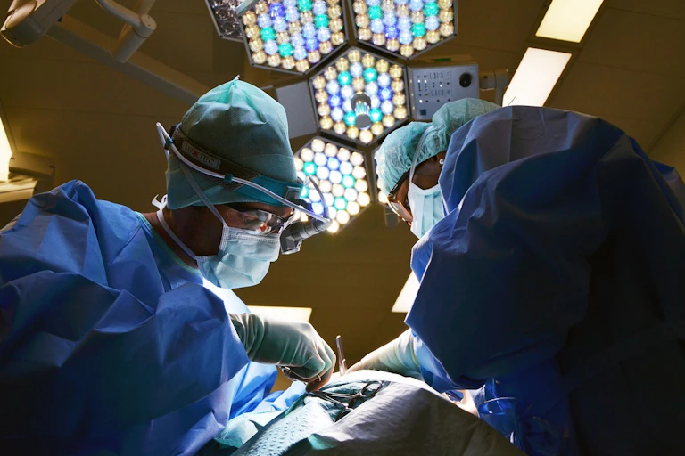 Two surgeons operate on a patient.
