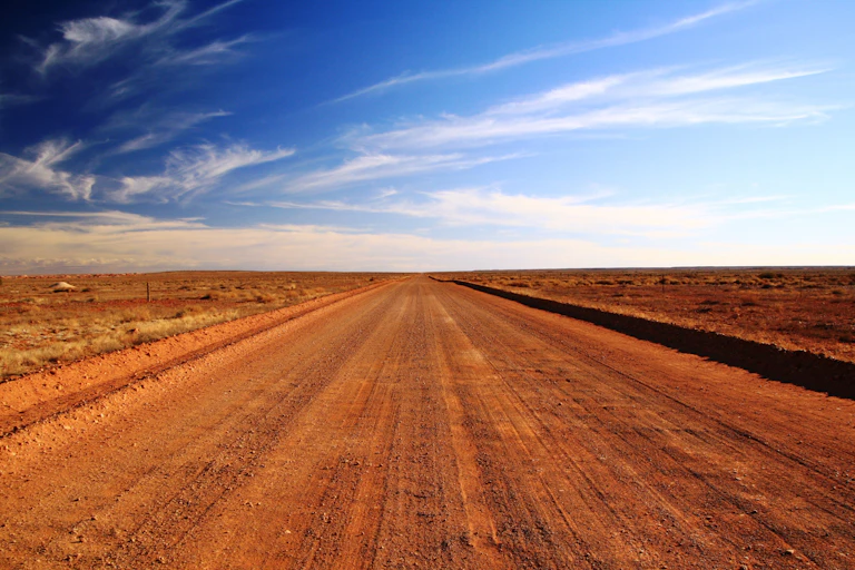 outback road under blue sky