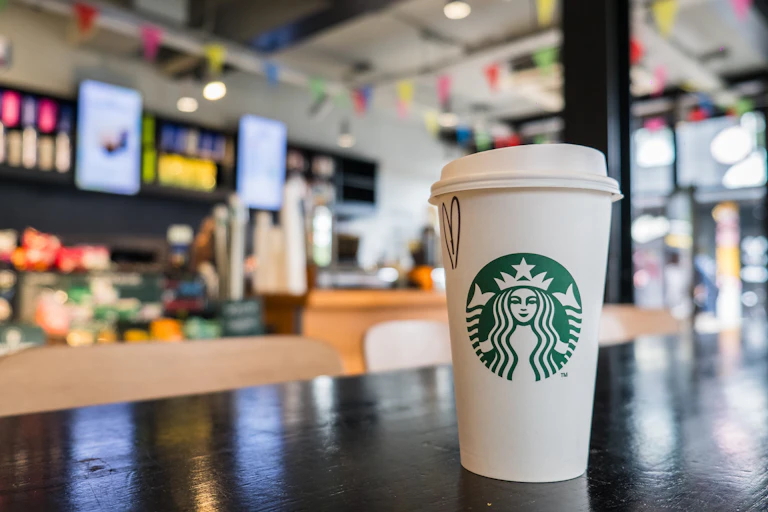 starbucks coffee cup on a counter