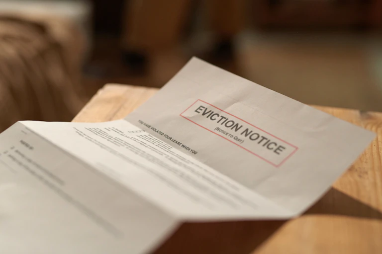 An eviction notice letter on a table