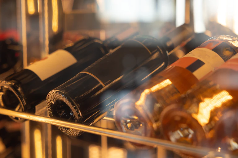 Wine bottles on a rack