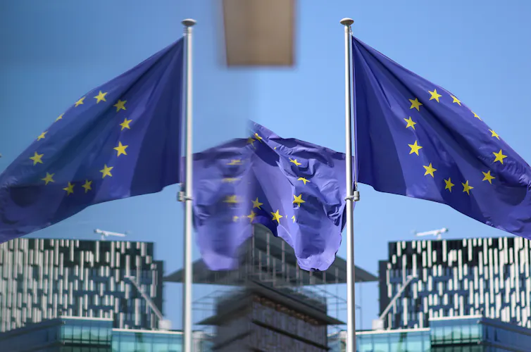 European Union flags fly in front of European Commission headquarters