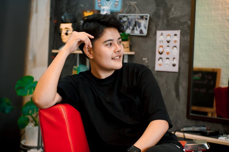 Non-binary person at a barbershop