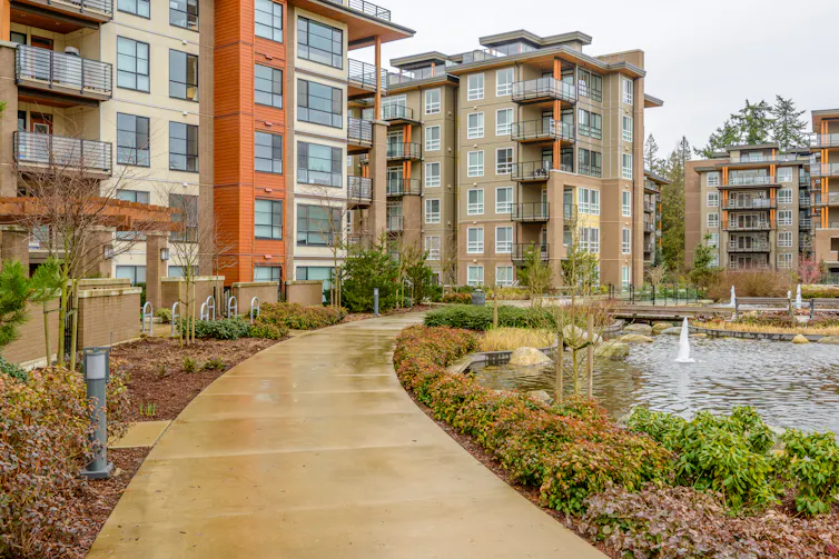 Many modern apartment buildings sharing the same space