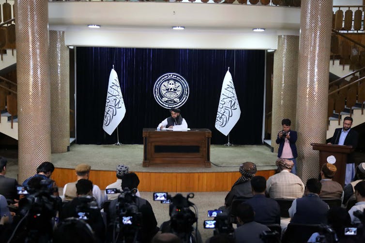 Takiban spokesman Zabiullah Mujahid addresses journalists at a press conference in Doha, Qatar, June 2024.