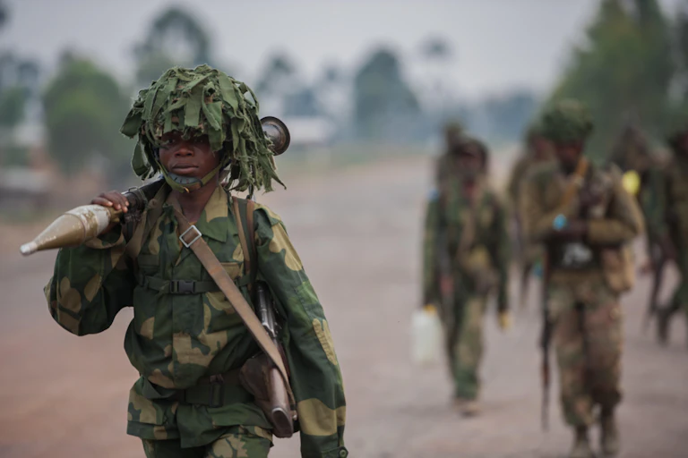 A Congolese soldiers carrying an RPG.