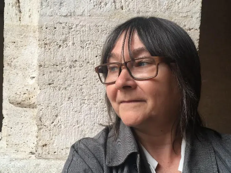 Ali Smith in glasses and a grey jacket