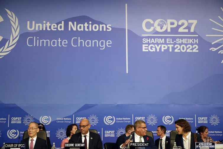 A group of people sit at a table.