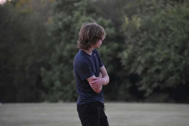essay on mental health and technology A moody teenage boy, in T-shirt and jeans, arms crossed.