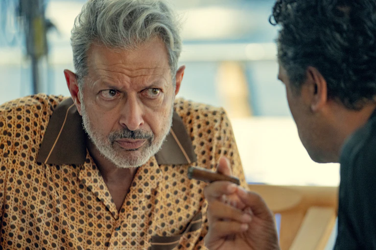 A still from a TV show shows Jeff Goldblum in a patterned shirt.