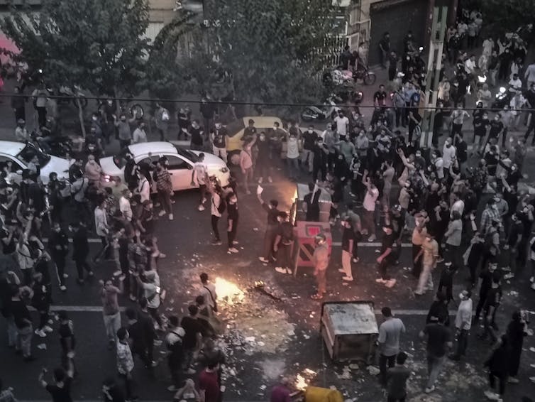 Iranians protesting in a street.