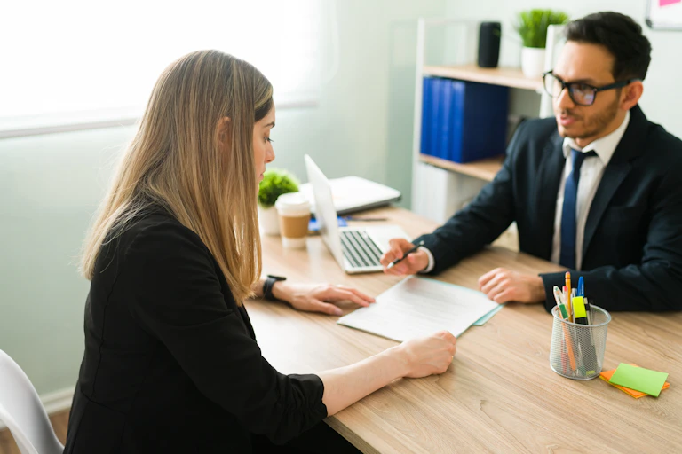 Salesman getting a woman to sign a contract
