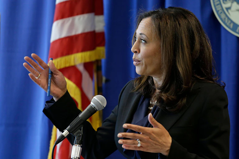 Kamala Harris in front of a California flag.