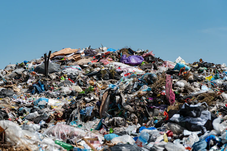 landfill rubbish in pile, blue sky