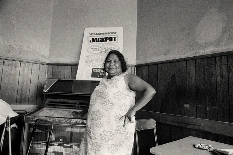 A woman in a floral sundress.
