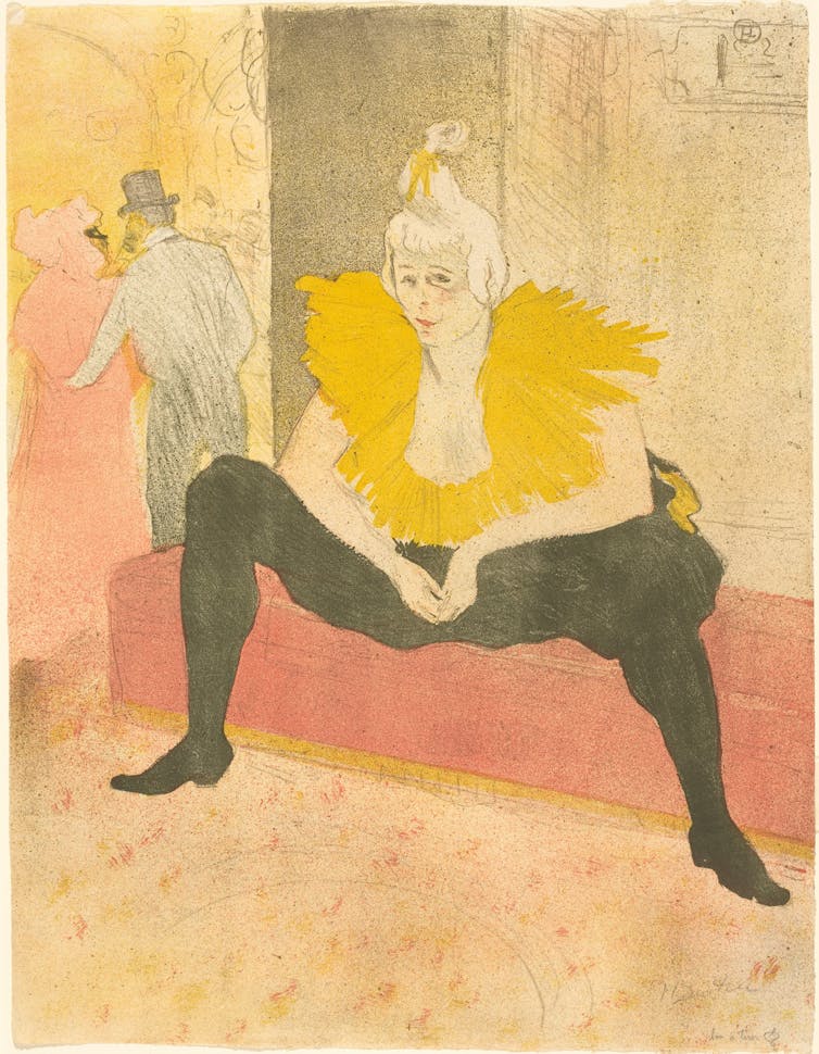 A female clown in black and yellow.