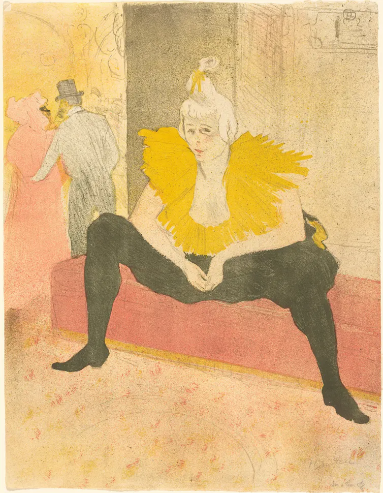 A female clown in black and yellow.