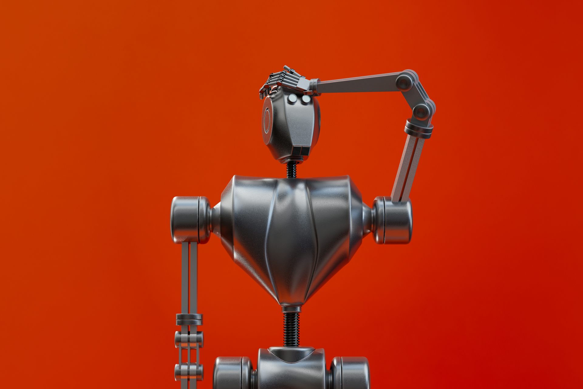 Un robot en métal se tape le front comme s'il avait oublié quelque chose, sur un fond rouge.